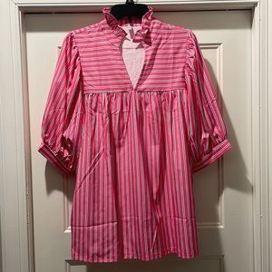 New, no tags. Polyester material. Beautiful V neck with ruffled neck.